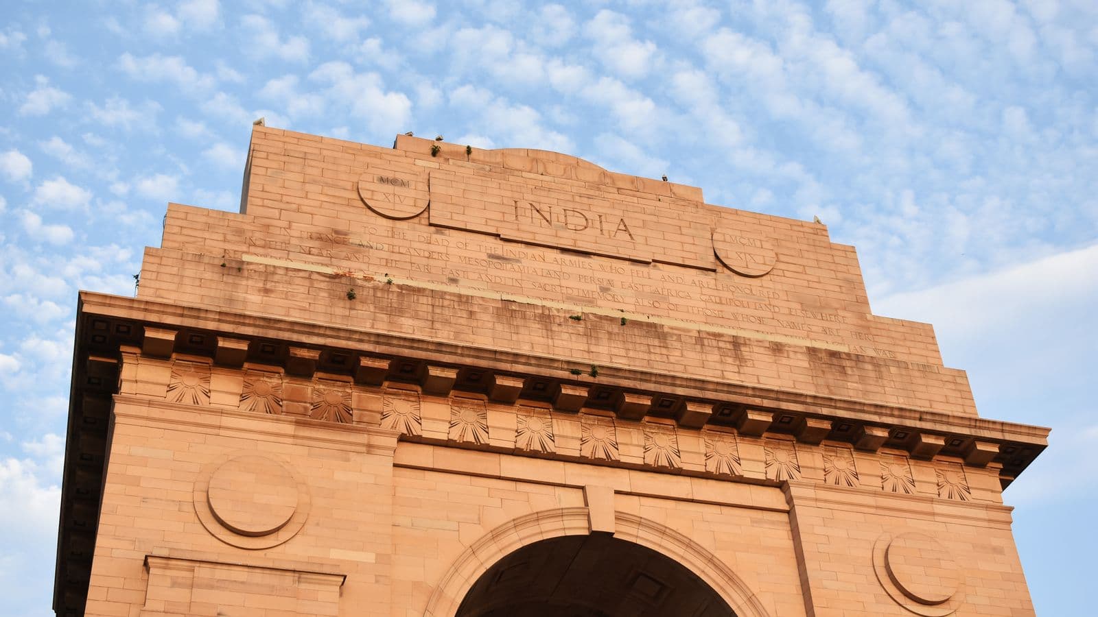 India Gate in New Delhi under a blue sky